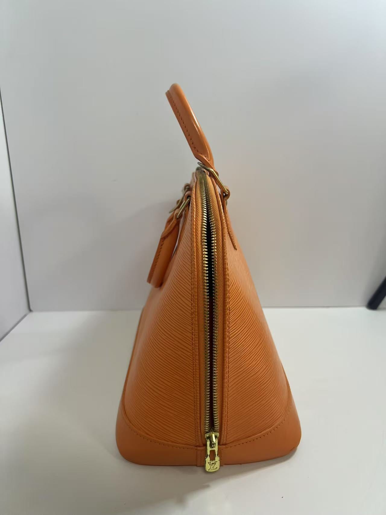 Louis Vuitton Alma PM Mandarin Epi Leather Handbag