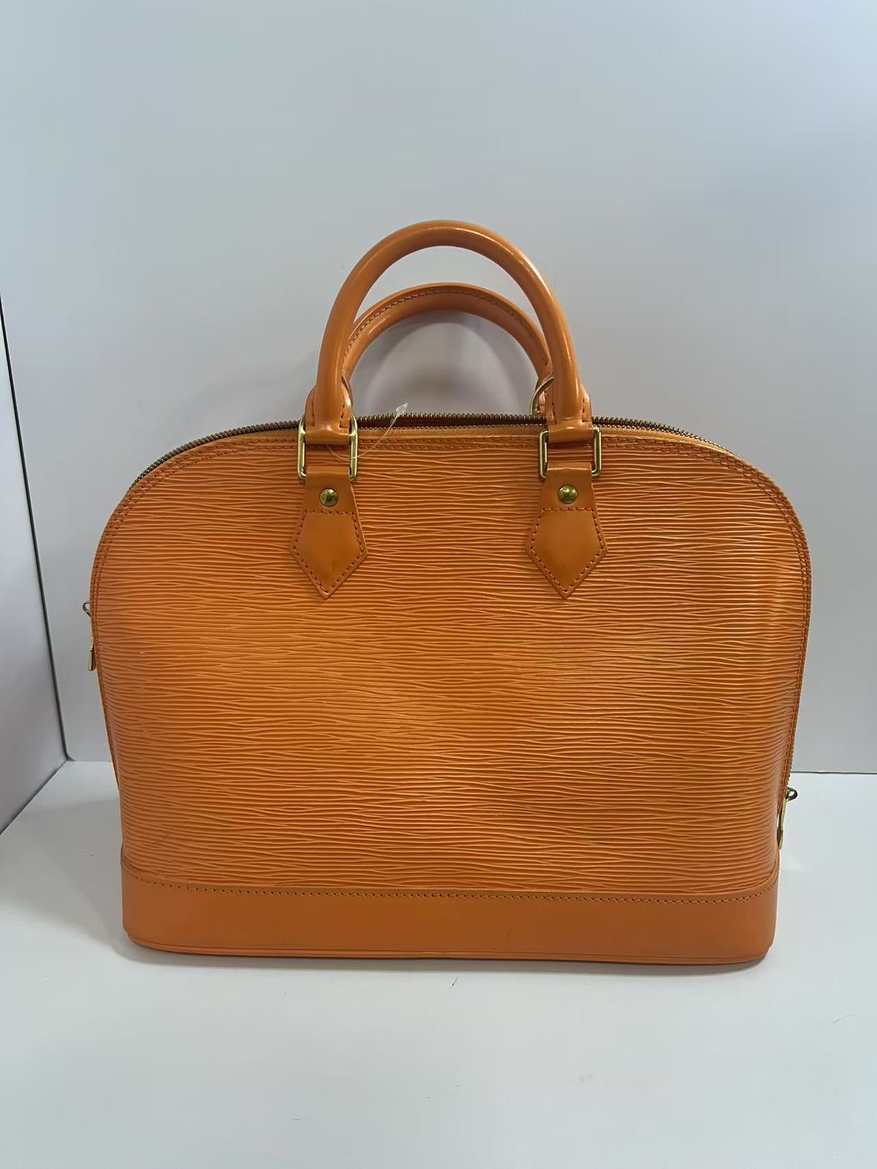 Louis Vuitton Alma PM Mandarin Epi Leather Handbag