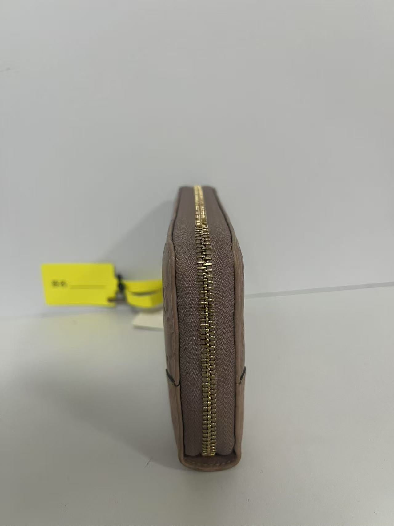 Gucci Guccissima Dusty Pink Embossed Leather Zip-Around Wallet