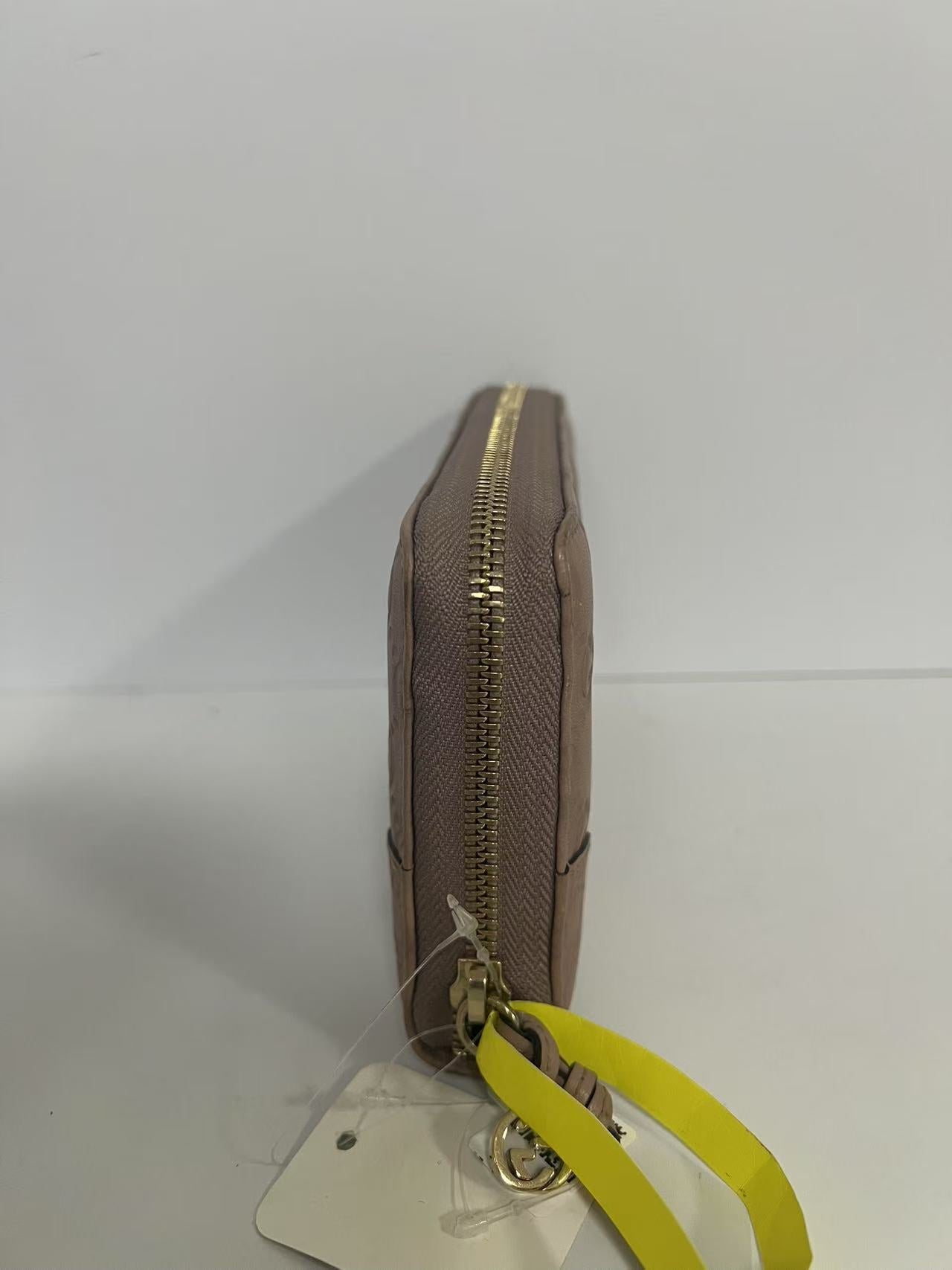 Gucci Guccissima Dusty Pink Embossed Leather Zip-Around Wallet