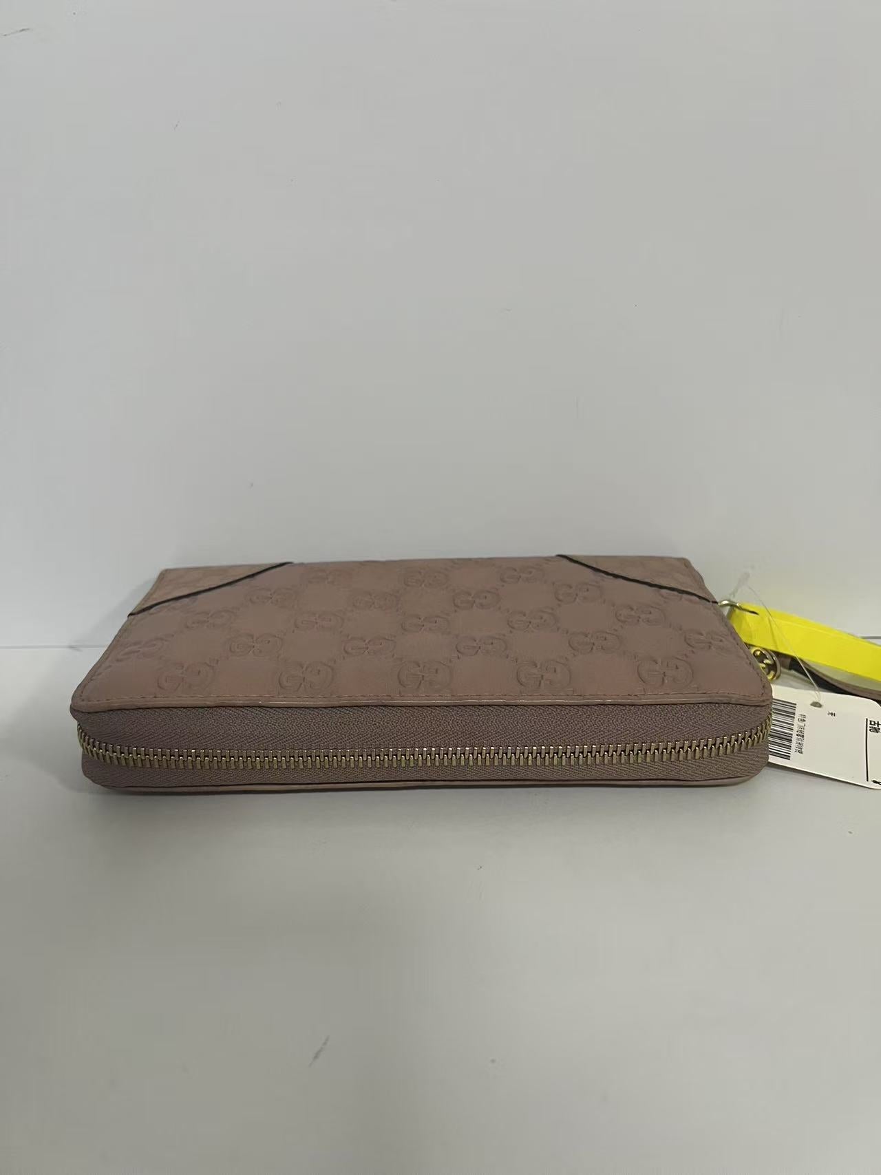 Gucci Guccissima Dusty Pink Embossed Leather Zip-Around Wallet
