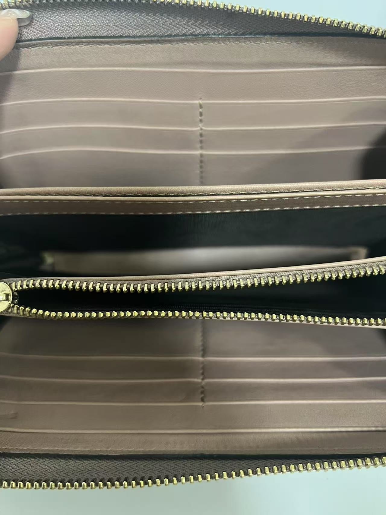 Gucci Guccissima Dusty Pink Embossed Leather Zip-Around Wallet