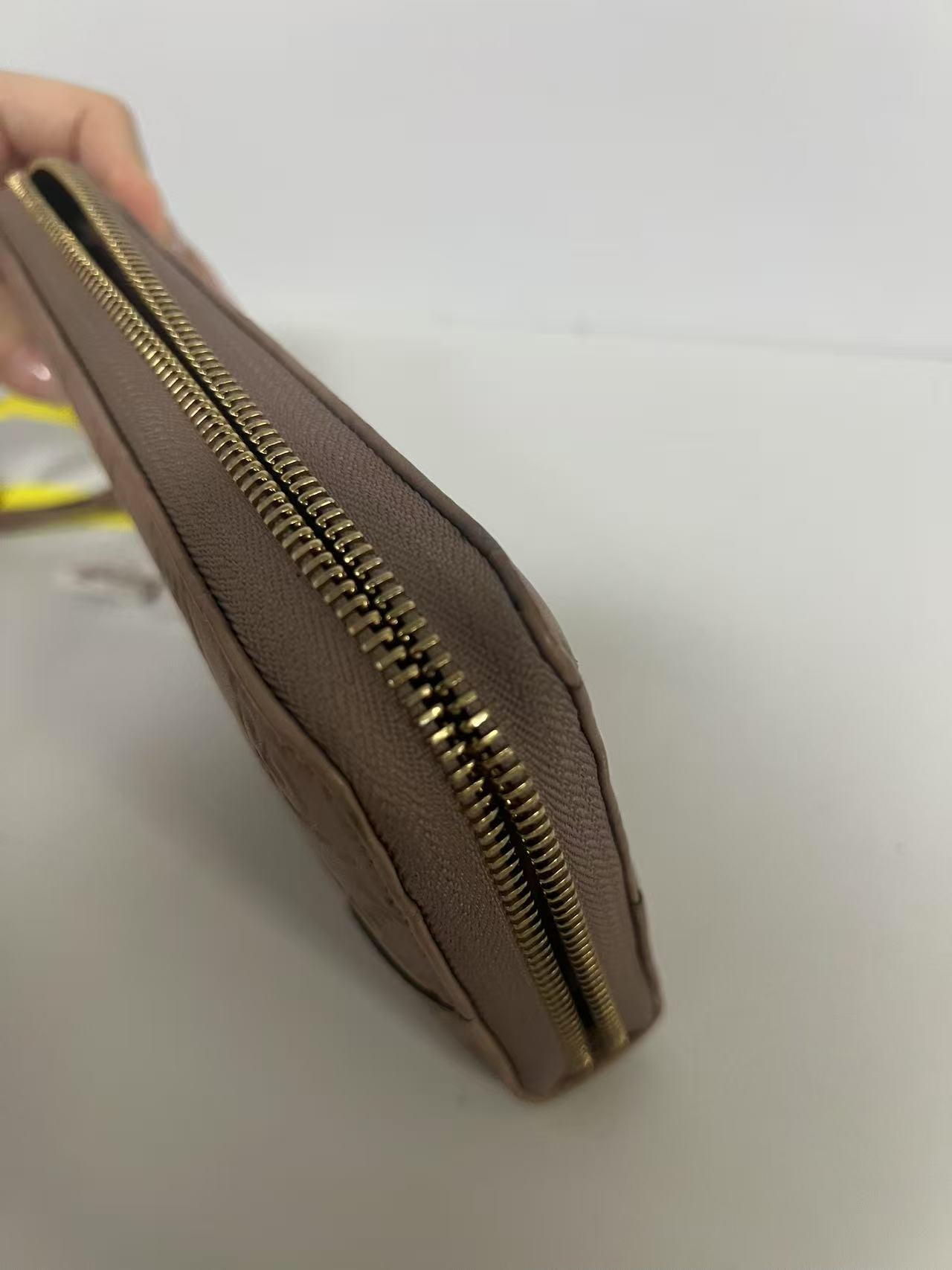 Gucci Guccissima Dusty Pink Embossed Leather Zip-Around Wallet