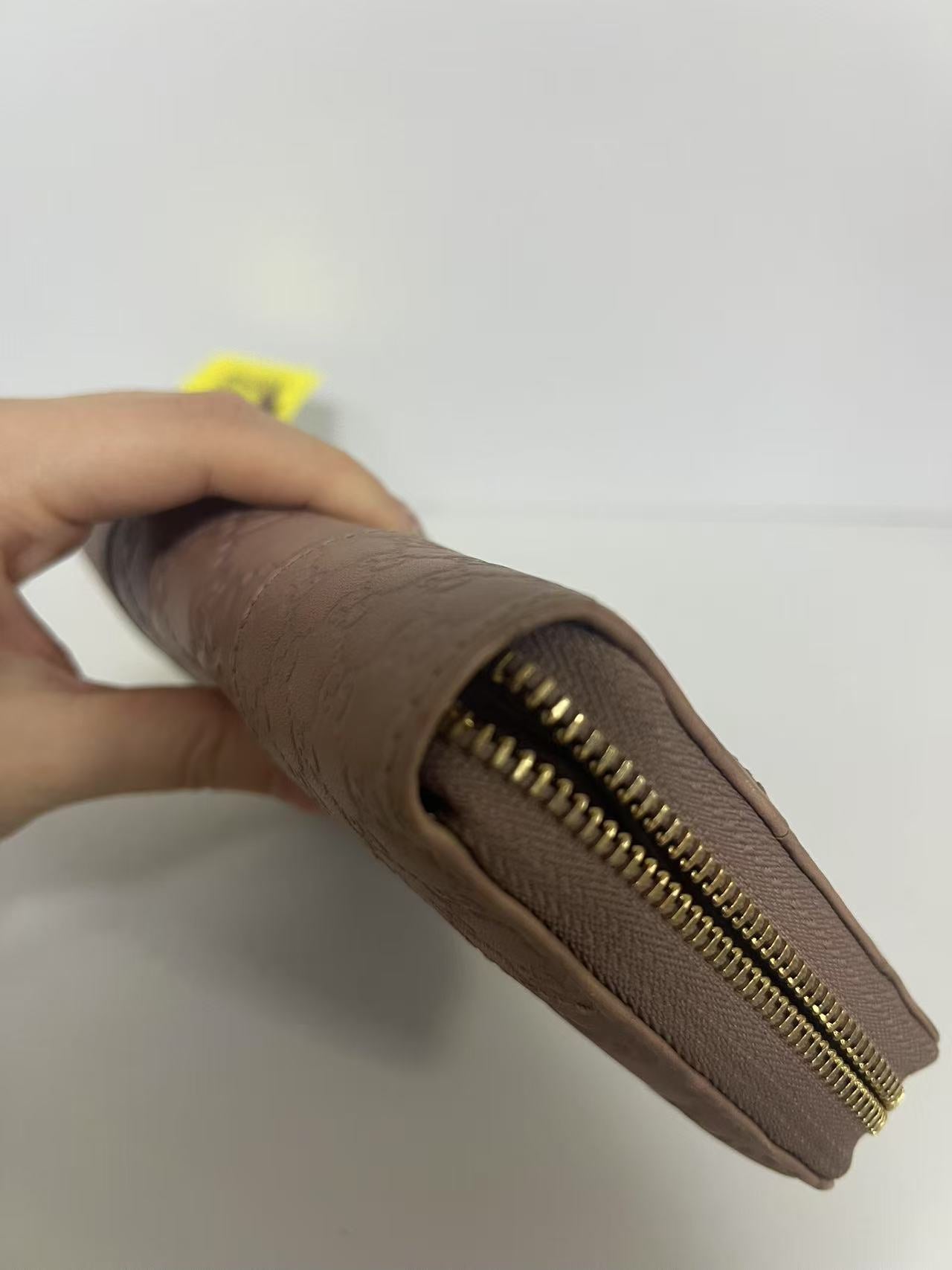 Gucci Guccissima Dusty Pink Embossed Leather Zip-Around Wallet