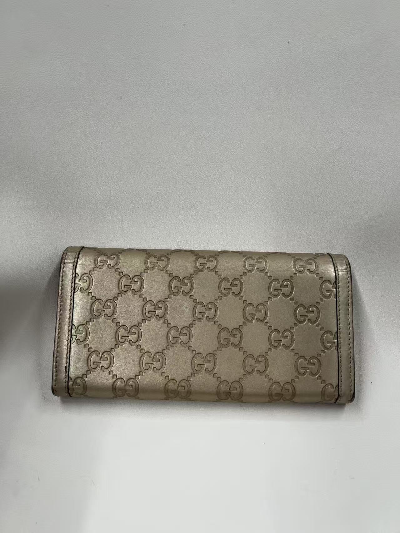 Gucci GG Signature Leather Continental Wallet